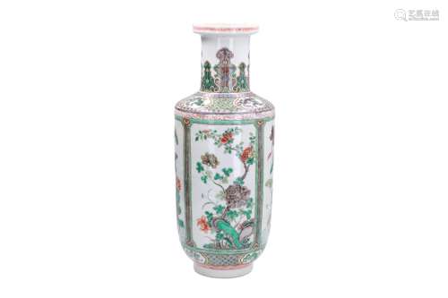 A famille verte porcelain rouleau vase, decorated with flowers and butterflies in reserves.