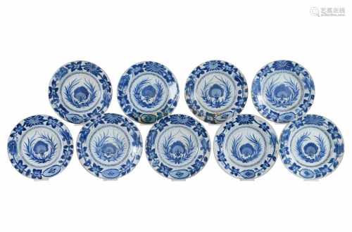 A set of nine blue and white porcelain dishes with floral decor. Marked with symbol. China,