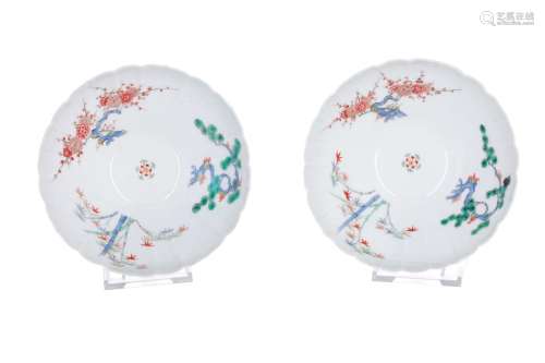 A pair of Kakiemon-style polychrome bowls with scalloped rim, decorated with the three friends of