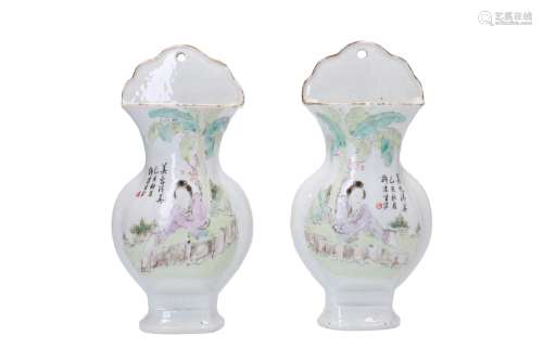 A pair of polychrome porcelain wall vases, decorated with a lady and characters. Unmarked. China,