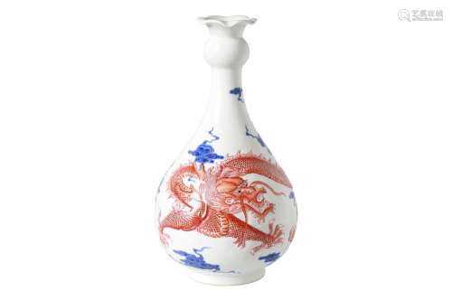 A blue and white with iron red porcelain vase, decorated with dragon and clouds. Marked with seal