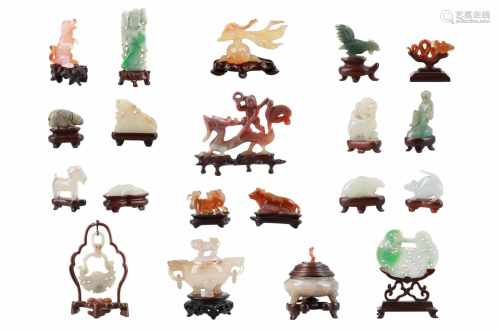 Lot of twenty diverse jade and agate sculptures on wooden bases. China, 19th/20th century.