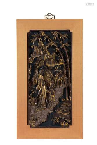 A wooden plaque in frame, with carved and gilded decor of figures and an animal on a terrace, in
