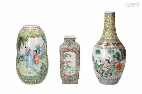 Lot of three polychrome porcelain vases, decorated with 1) cranes and flowers. H. 30 cm. 2)