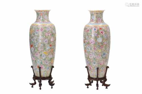 A pair of two Millefleurs porcelain vases on wooden base. Marked with seal mark Qianlong. China,