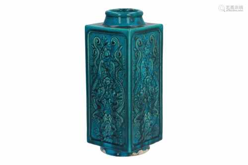 A turquoise porcelain cong vase, decorated in relief with dragons and flowers. Marked with seal mark