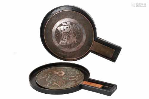 Lot of two bronze mirrors in lacquer boxes, decorated with 1) a butterfly 2) flowers, birds and