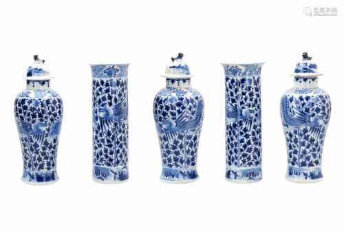 A five-piece blue and white porcelain garniture, decorated with phoenixes, flowers and