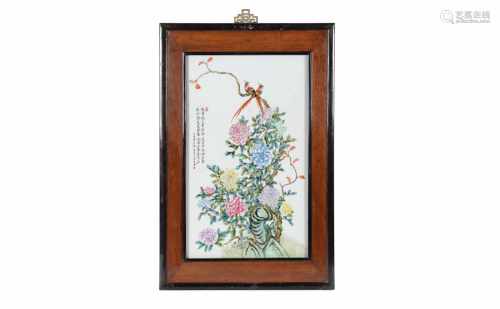 A polychrome porcelain plaque in wooden frame, depictings birds, flowers and a poem. Made in 1971.