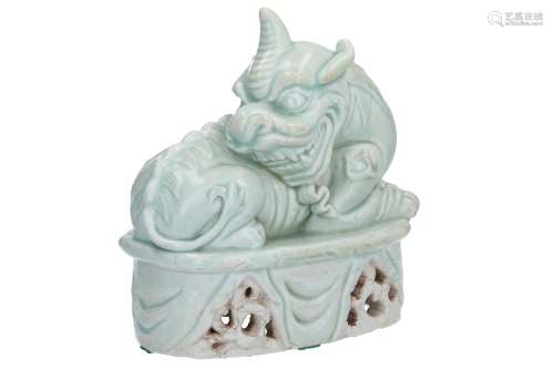 A celadon glazed sculpture of a mythical beast on pedestal. Unmarked. China, probably Sung. With
