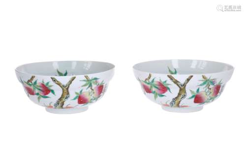 A pair of two polychrome porcelain bowls, decorated with peach tree and bat. Marked with seal
