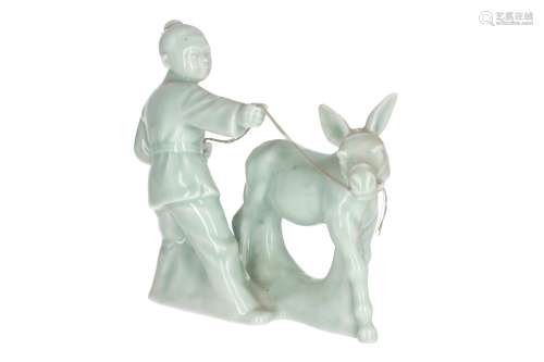 A celadon Yixing sculpture, depicting a boy with a mule. Unmarked. China, 20th century. H. 16,5