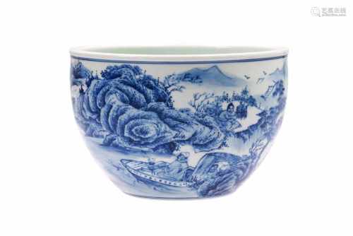 A blue and white porcelain bowl, decorated with a mountainous river landscape and boats. Marked with