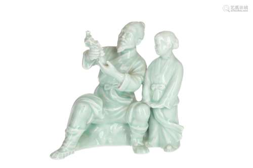 A celadon glazed Yixing sculpture, depicting a man showing flowers to a child. Unmarked. China, 20th