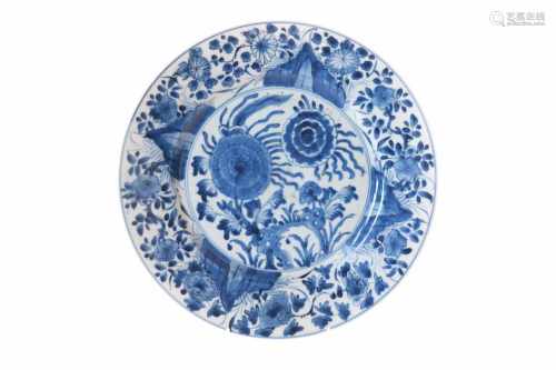 A blue and white porcelain dish, decorated with flowers. Marked with Ding incense burner. China,