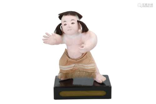 A Japanese doll of a standing sumo wrestler. Japan, 19th/20th century. H. 30 cm.