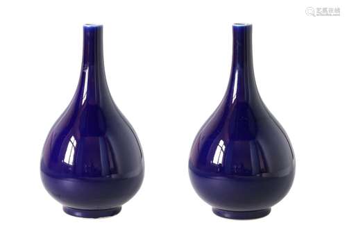 A pair of powder blue glazed longneck vases. Unmarked. China, 20th century. H. 34 cm. Provenance: