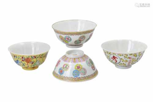 Lot of four polychrome porcelain bowls, decorated with flowers, bats and characters. Two marked with