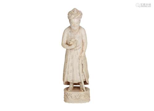 A finely carved ivory sculpture of a standing figure (possibly Shah Jahan, the 5th Mughal Emperor)