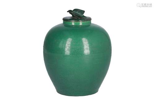 A green glazed porcelain jar with metal lid. Marked with seal mark Zhang Zhou Dian Tong Guang He