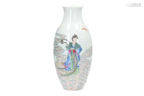 A polychrome porcelain vase, decorated with a figure in the clouds, birds and a bat. Marked with