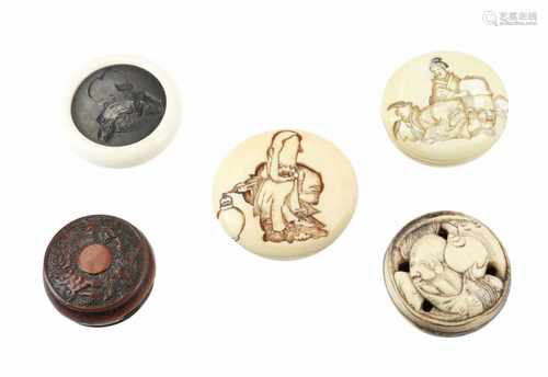 Lot of five manju, 1) Wood, depicting shishi and peonies. Diam. 3,5 cm. 2) Ivory, depicting