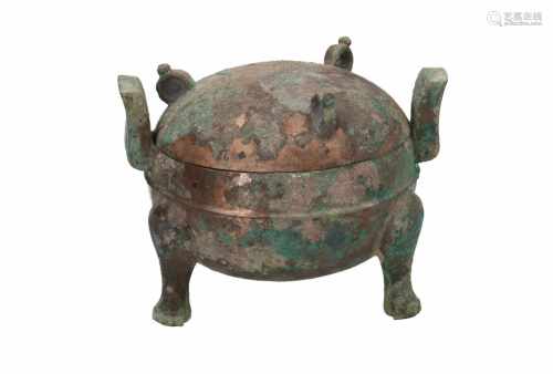 A bronze tripod covered Ding. The body with two handles, the lid with three rings. China, western