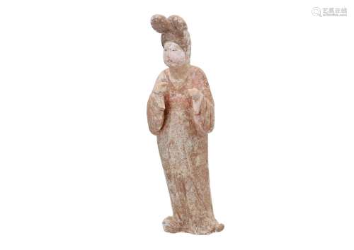 An unglazed red pottery fat lady, with traces of polychrome. China, Tang, 8th/9th century. Added the