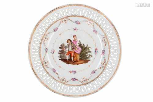 A polychrome porcelain dish, decorated with a couple and flowers. The rim with open work.