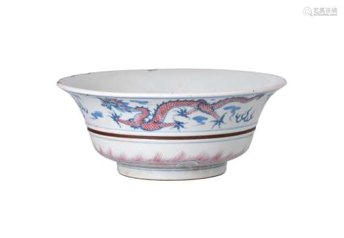 A blue and underglaze red porcelain bowl, decorated with a dragon and phoenix. Marked with 6-