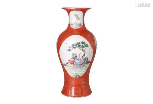 A polychrome porcelain vase, decorated with reserves depicting flowers and scenes with figures.