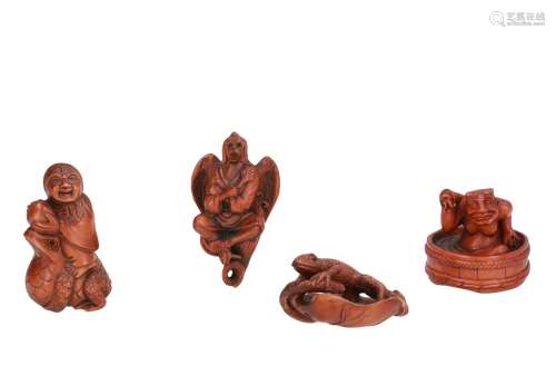 A lot of four wooden netsuke, depicting figures and animals. Marked. Japan, 19th/20th century. H.