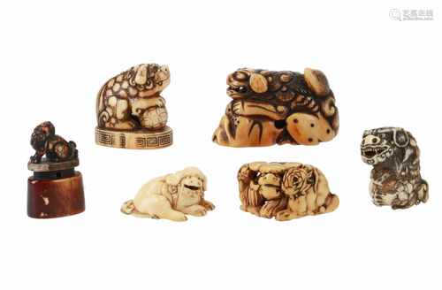 Lot of four netsuke and two seal netsuke, 1) Staghorn shishi with rock and loose ball in mouth. L.