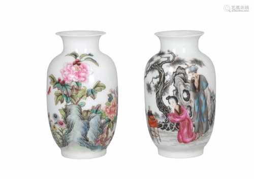 Lot of two polychrome porcelain vases, decorated with figures, flowers, characters and a cat. One