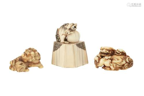 Lot of three netsuke, 1) Ivory reclining shishi with two cubs. Signed Tomochike. L. 4,5 cm. 2) Ivory