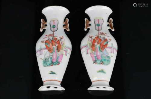 A pair of polychrome porcelain wall vases, decorated with figures in a garden. Unmarked. China, 20th