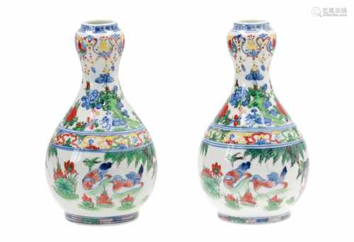 A pair of Doucai porcelain vases, decorated with flowers, birds and insects. Unmarked. China, 20th