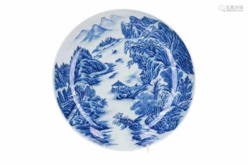A blue and white porcelain deep charger, decorated with mountainous river landscape. Marked with 6-