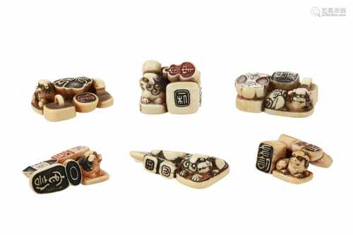 Lot of six seal netsuke, 1) Ivory shishi on base with seals. Signed. L. 3 cm. 2) Ivory shishi on