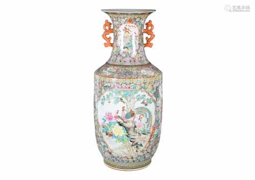 A polychrome porcelain vase with two handles, decorated with birds and flowers. Marked with seal