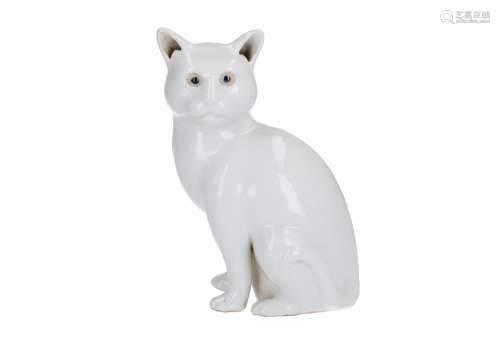 A white glazed porcelain sculpture of a sitting cat. Unmarked. China, 20th century. H. 20 cm.