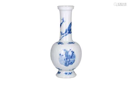 A blue and white porcelain longneck vase with ribbed belly, decorated with a dragon and three