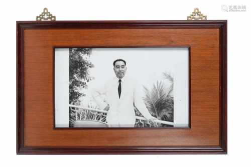 A black and white porcelain plaque in wooden frame, depicting Zhou Enlai, the first prime minister