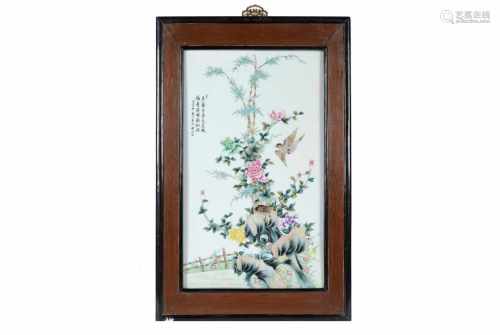A polychrome porcelain plaque in wooden frame, depicting birds, flowers and characters. China,