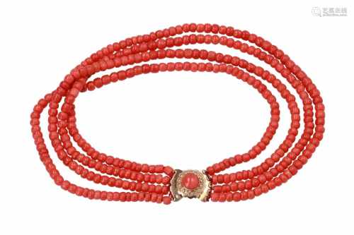 A four-strand red coral necklace with 14-kt gold clasp set with red coral. Diam. ca. 5,5 - 6,5 mm.