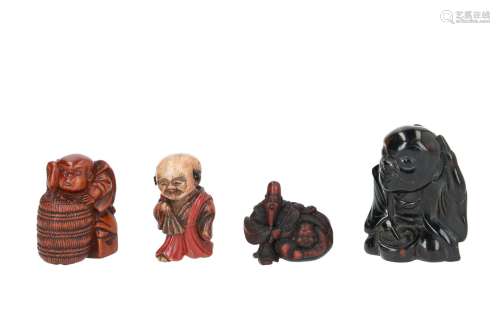 Lot of four netsuke, 1) Wood with lacquer, Fukusuke with fan. H. 4,5 cm. 2) Wooden Fukusuke with