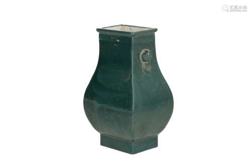 A green glazed Yixing vase with two handles. Marked with seal mark. China, 20th century. H. 17 cm.