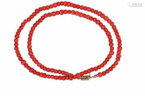 A red coral necklace with 14-kt gold clasp partly decorated with enamel and text: Souvenir,
