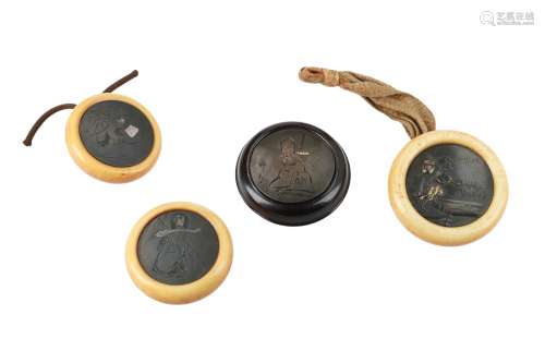Lot of four manju, 1) Ivory with metal, depicting Jurojin. Diam. 4 cm. 2) Ivory with partly gilded