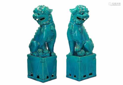 A pair of turquoise glazed porcelain sculptures of Fo-dogs. Unmarked. China, 20th century. H. 46